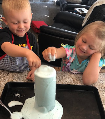 Example of what the elephant toothepaste science experiment looks like, foam coming out of the bottle or cup.