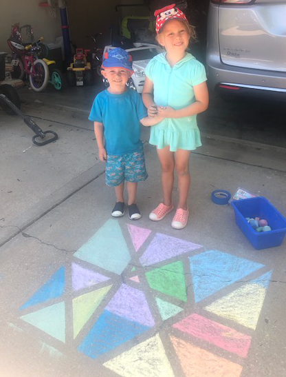 Example of the mosaic sidewalk chalk, various colors used and tape is removed to display varying shapes formed.
